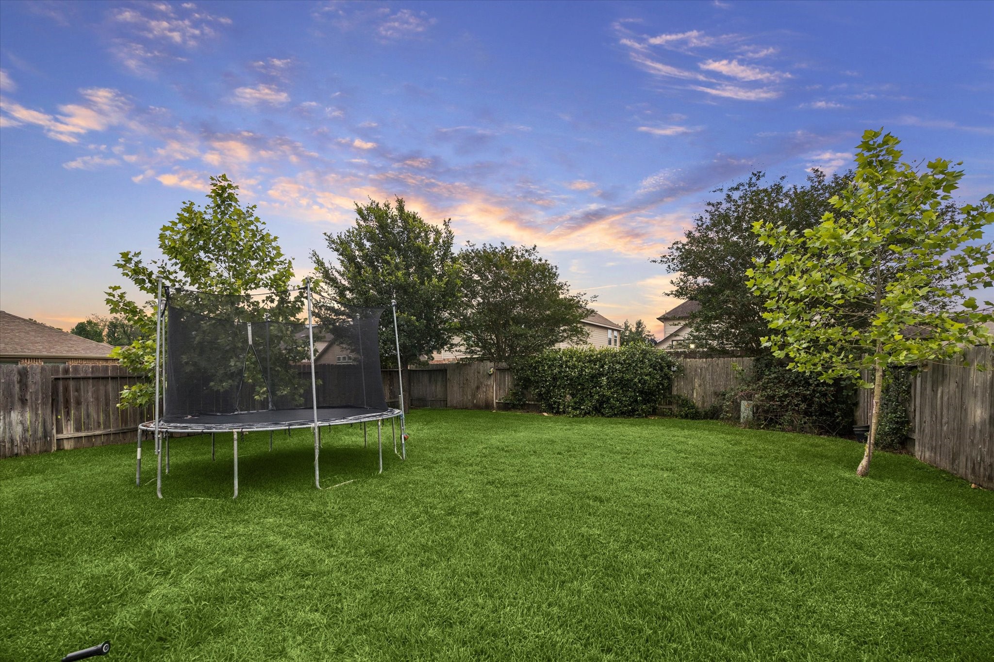 7015 Riata Hills Lane Spring, TX 77379 - Photo 28 of 33 Expansive backyard offering the perfect setting for outdoor living and entertaining, with ample space to design and build a custom pool.