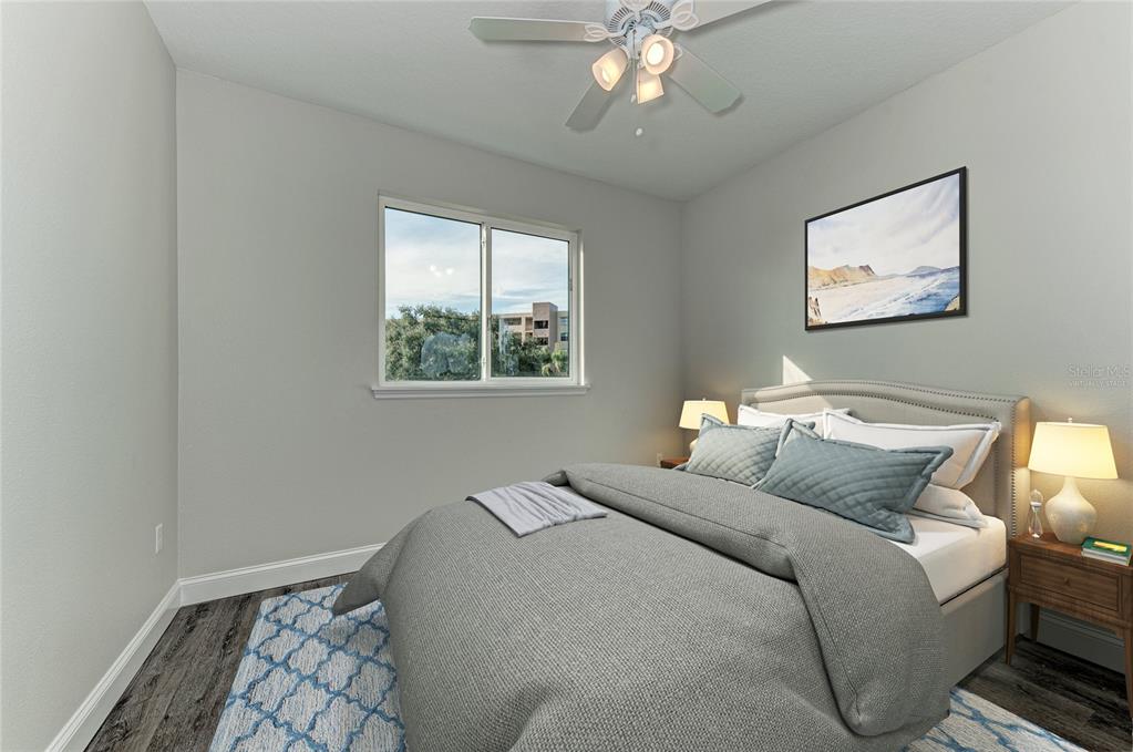 2225 14th Avenue West, Unit 204 Palmetto, FL 34221 - Photo 2 of 10 a bedroom with bed and a window