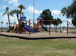 2225 14th Avenue West, Unit 204 Palmetto, FL 34221 - Photo 9 of 10 a view of a park with swings and slides