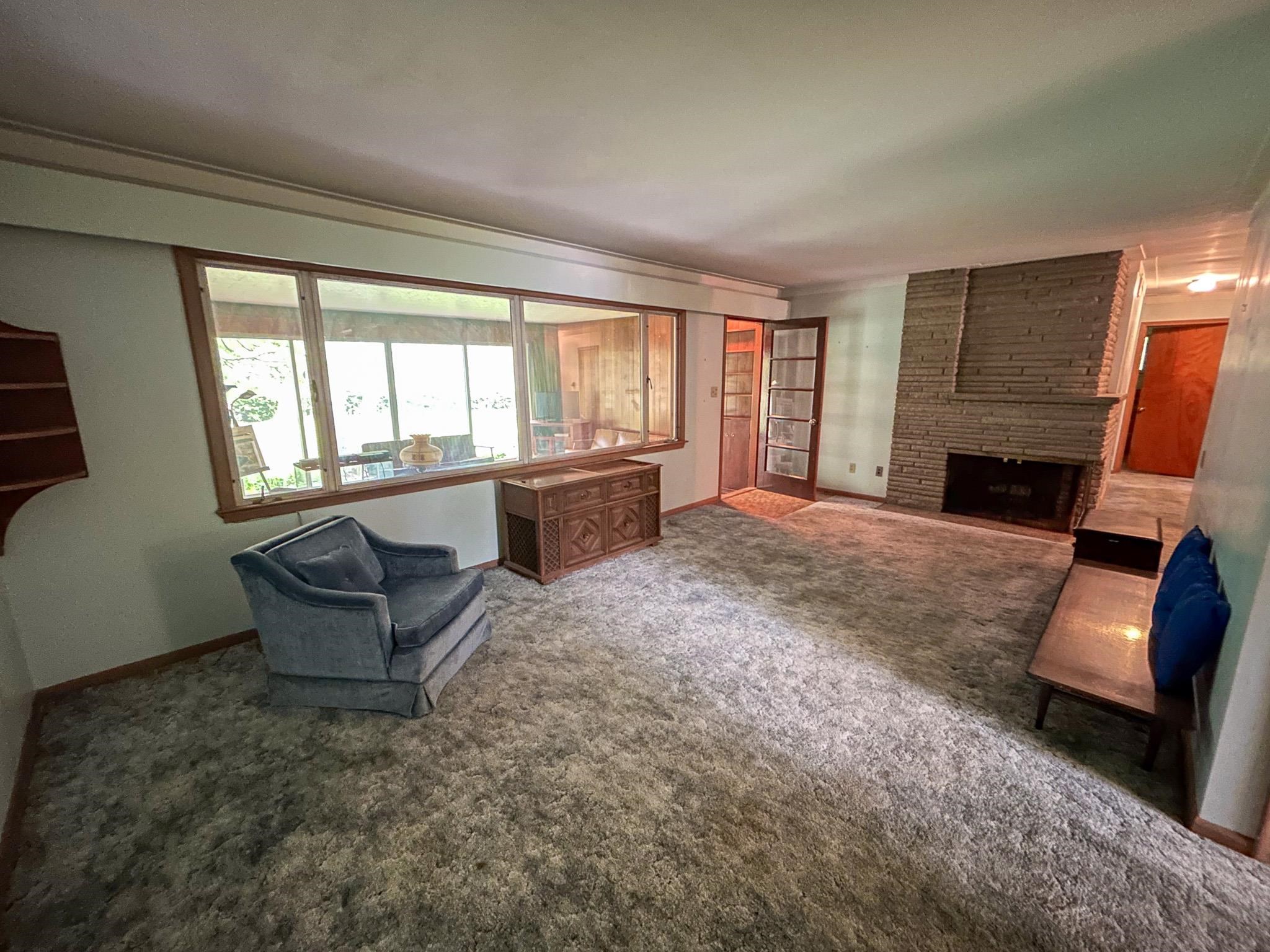 1227 Howe Road Burton, MI 48509 - Photo 7 of 27 Living Room w/fireplace