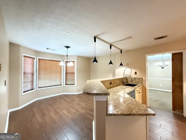 a living room with granite countertop furniture and a fireplace