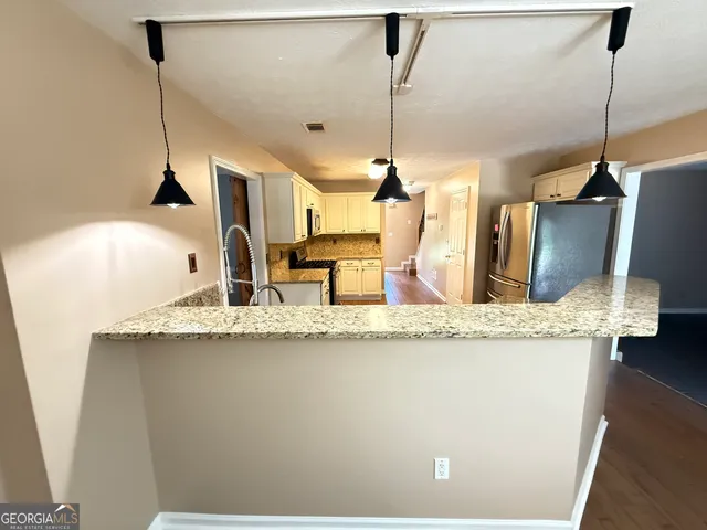 a kitchen with sink and window