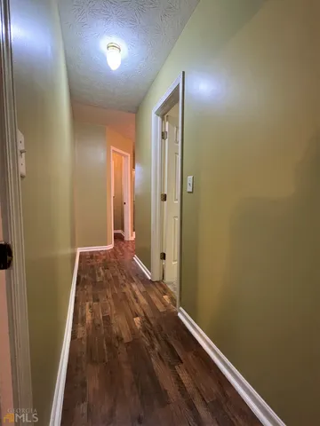 a bedroom with a bed and a mirror