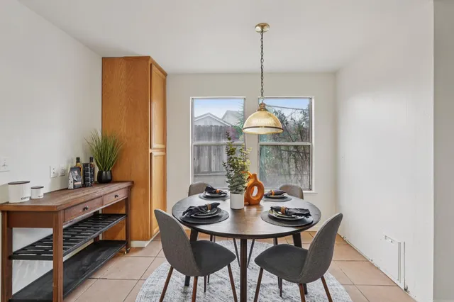 a view of a dining room with furniture window and outside view