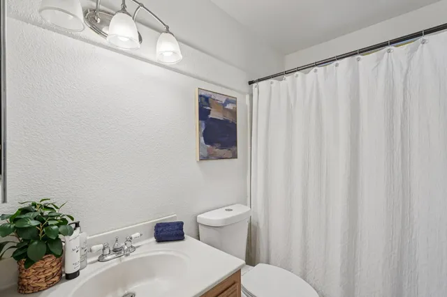 a bathroom with a sink and toilet