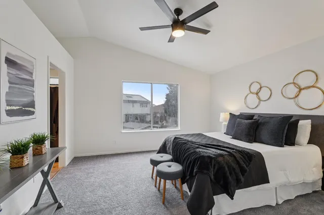 a bedroom with a bed and window