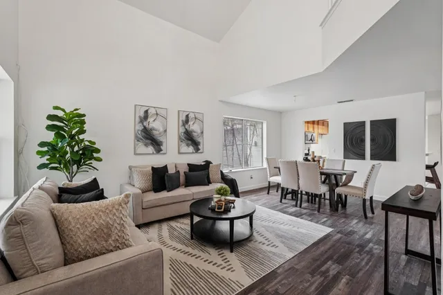 a living room with furniture and a rug