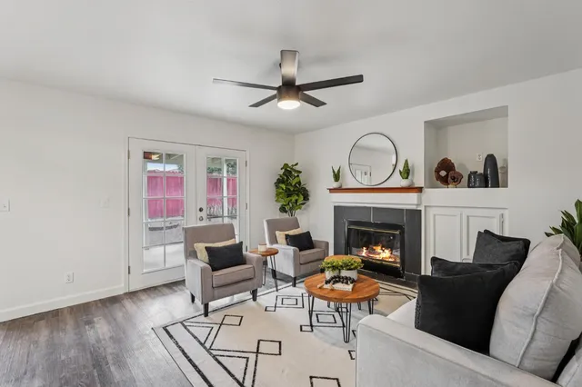a living room with furniture and a fireplace