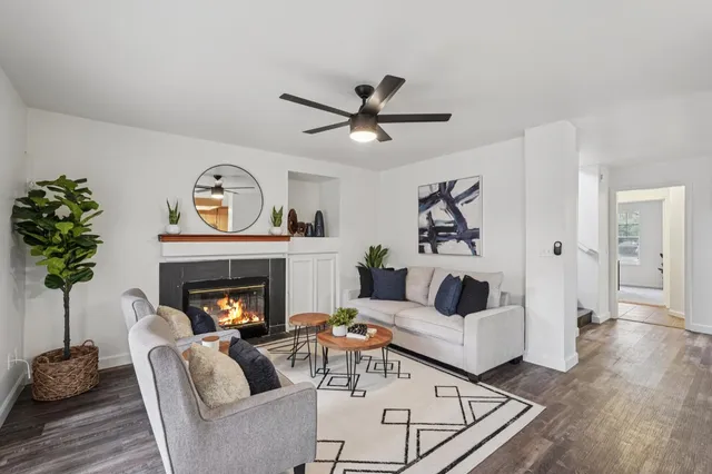 a living room with furniture and a fireplace