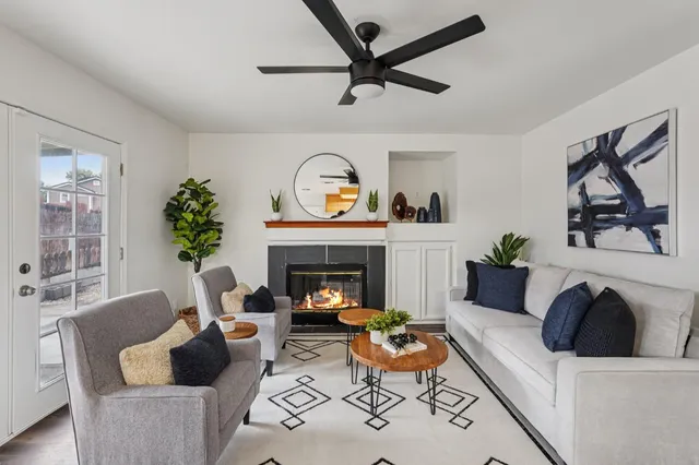 a living room with furniture and a fireplace