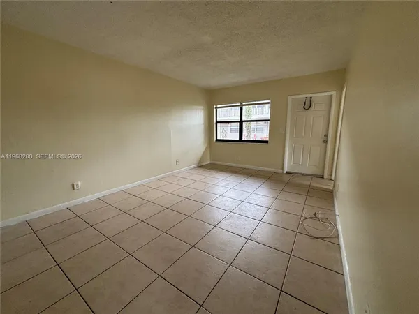 a view of empty room with windows