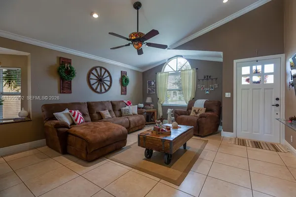 a living room with furniture and a large window