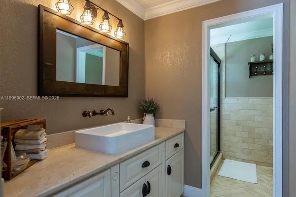 a bathroom with a sink and a mirror