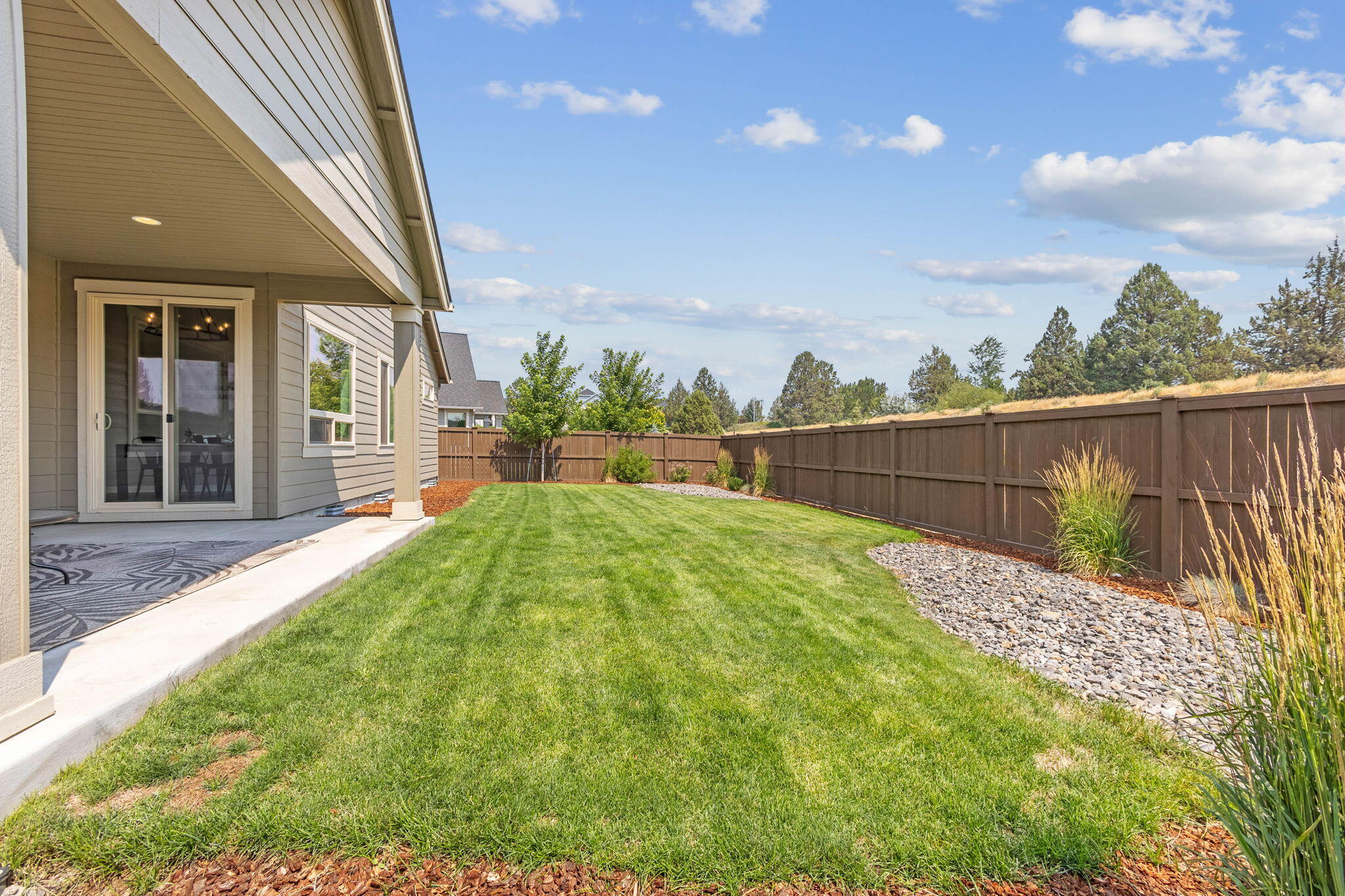 4396 Southwest 36th Street Redmond, OR 97756 - Photo 32 of 36 Landscaped backyard with sprinklers on timers.