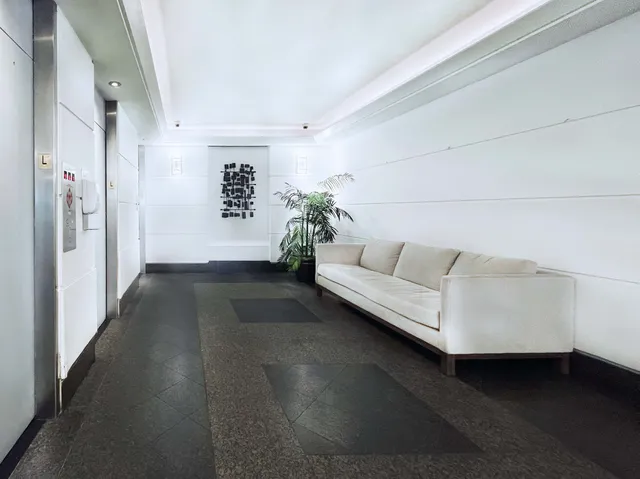 a view of a house with potted plants