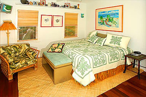 2211 D Pane Road Koloa, HI 96756 - Photo 10 of 12 a bedroom with a bed and wooden floor