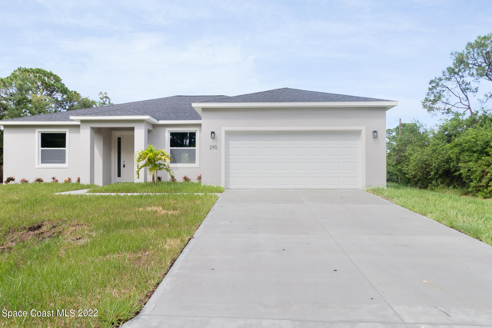 295 San Marino Road Southwest Palm Bay, FL 32908 - Photo 1 of 49 a front view of house with yard and green space