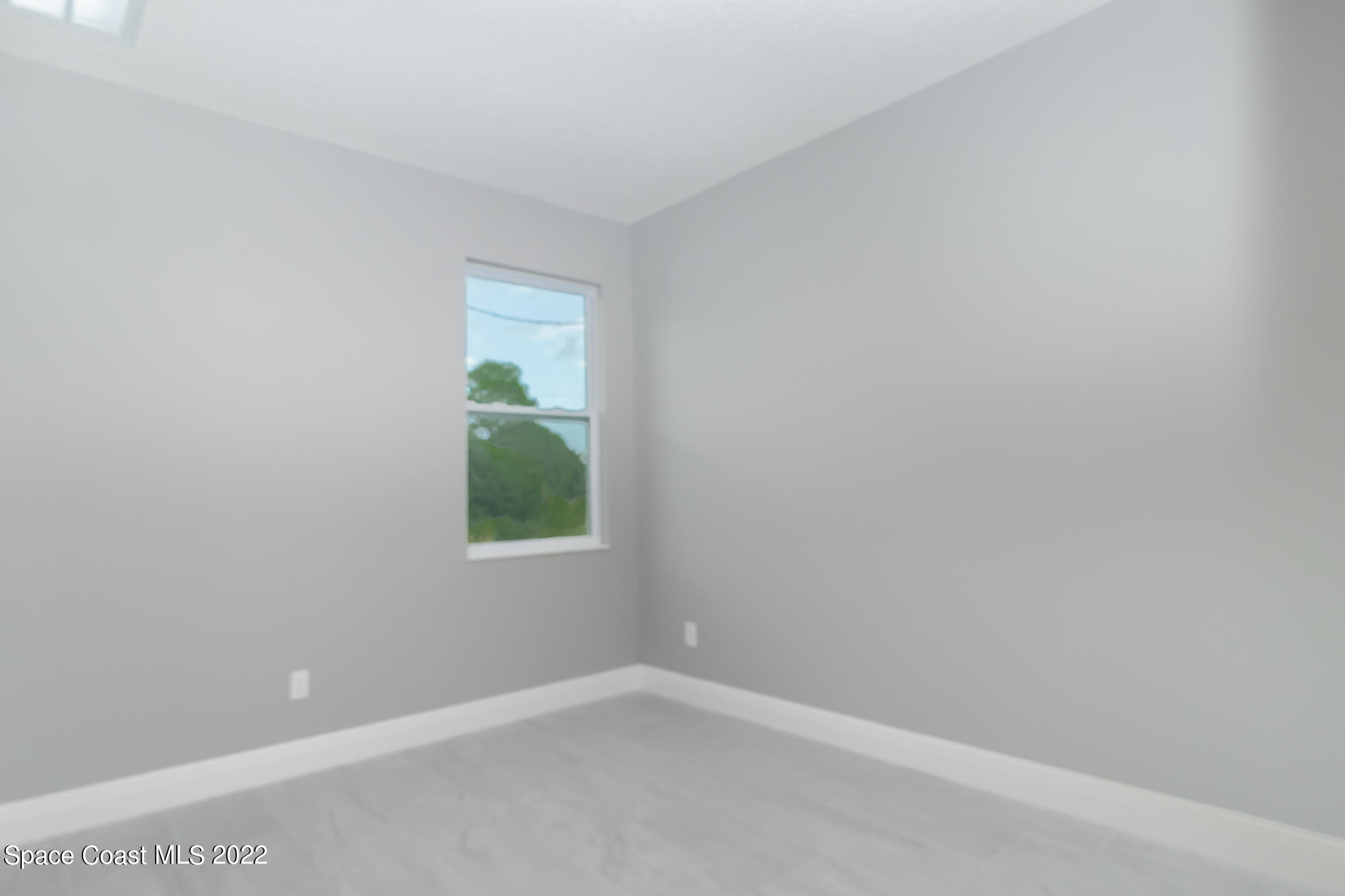 295 San Marino Road Southwest Palm Bay, FL 32908 - Photo 12 of 49 a room that has a window in it