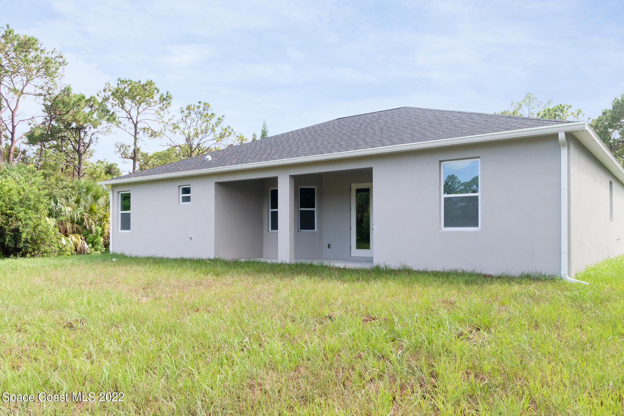 295 San Marino Road Southwest Palm Bay, FL 32908 - Photo 16 of 49 a backyard of a house