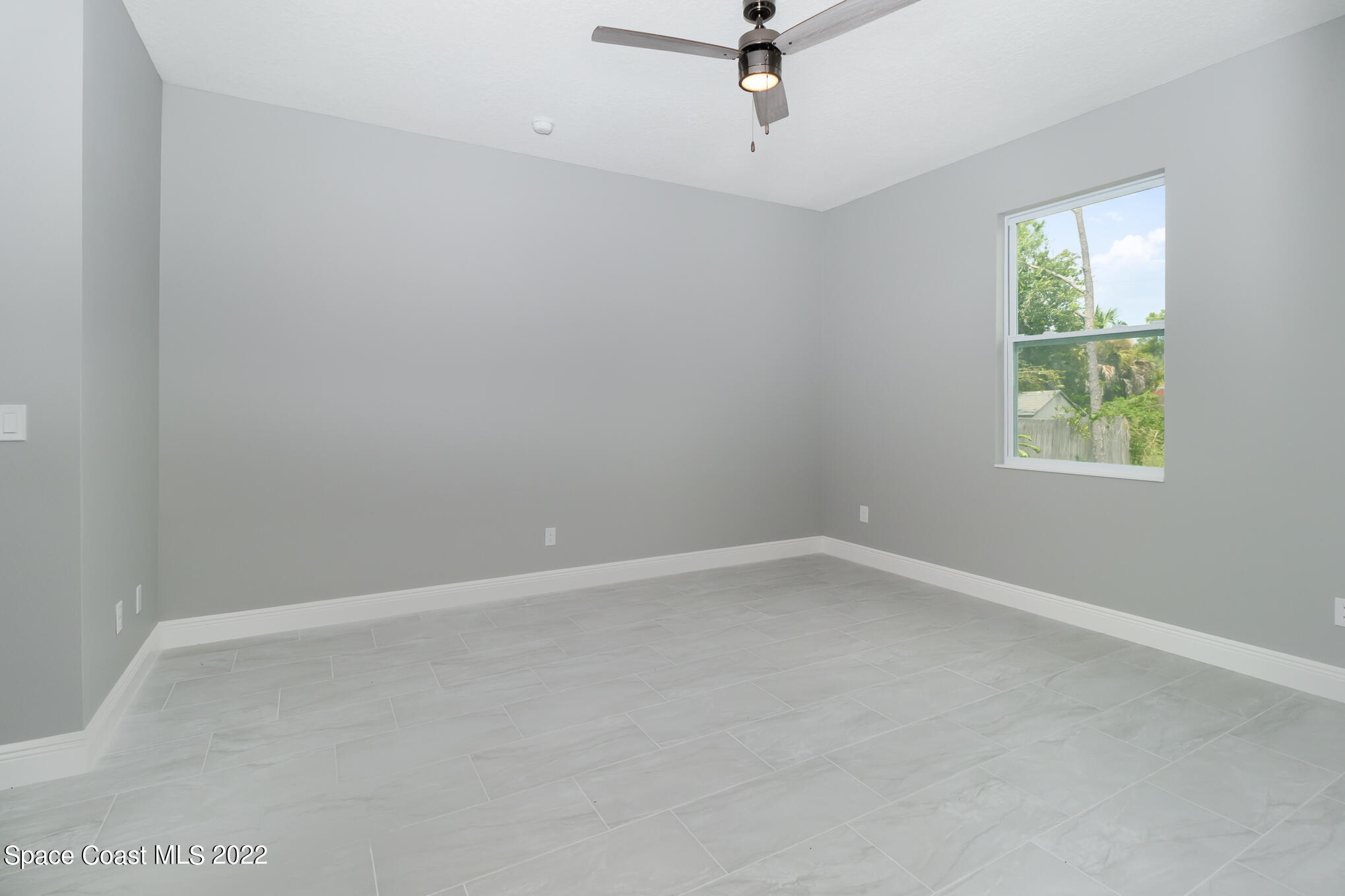 295 San Marino Road Southwest Palm Bay, FL 32908 - Photo 20 of 49 an empty room with a window