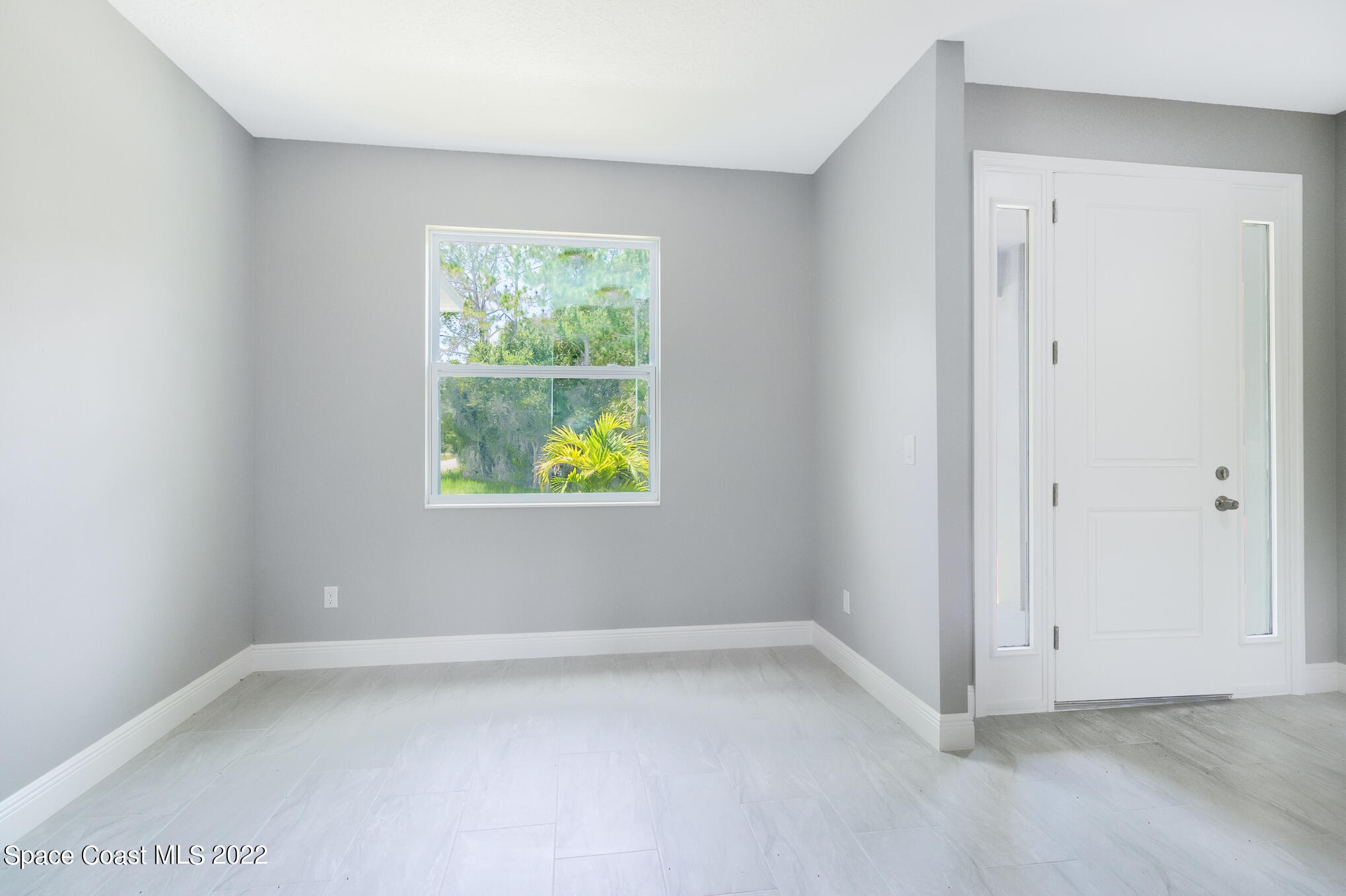 295 San Marino Road Southwest Palm Bay, FL 32908 - Photo 23 of 49 a view of an empty room with window
