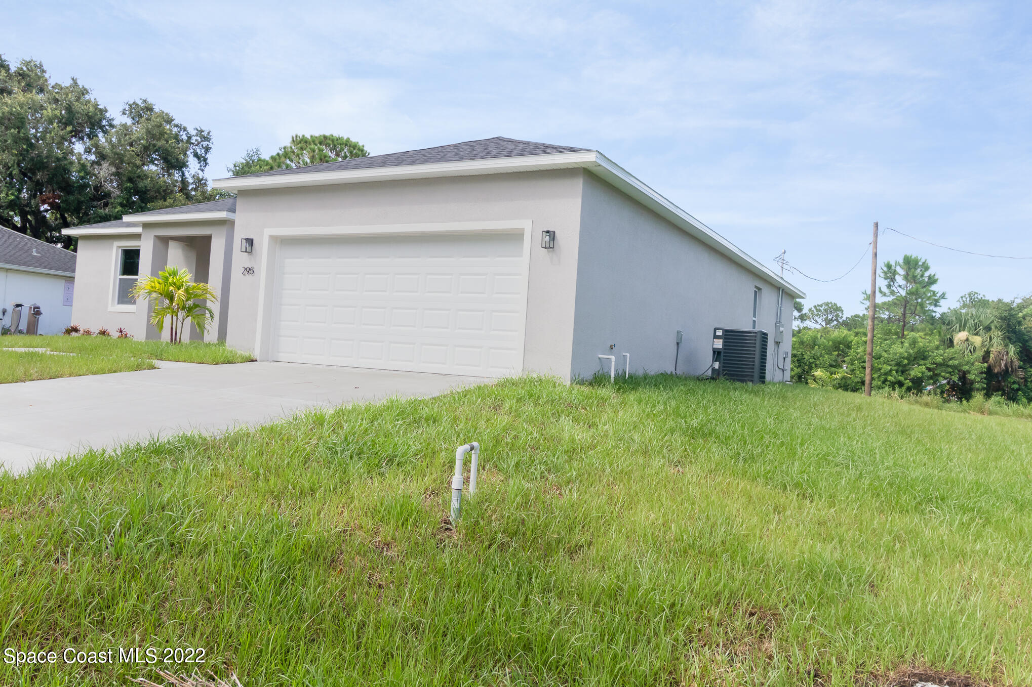 295 San Marino Road Southwest Palm Bay, FL 32908 - Photo 3 of 49 a view of a house with backyard and garden