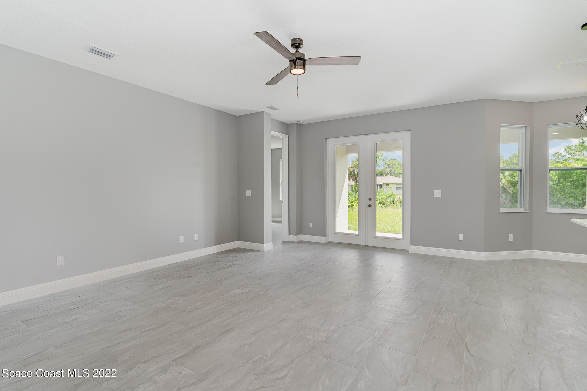 295 San Marino Road Southwest Palm Bay, FL 32908 - Photo 33 of 49 a view of an empty room with a window