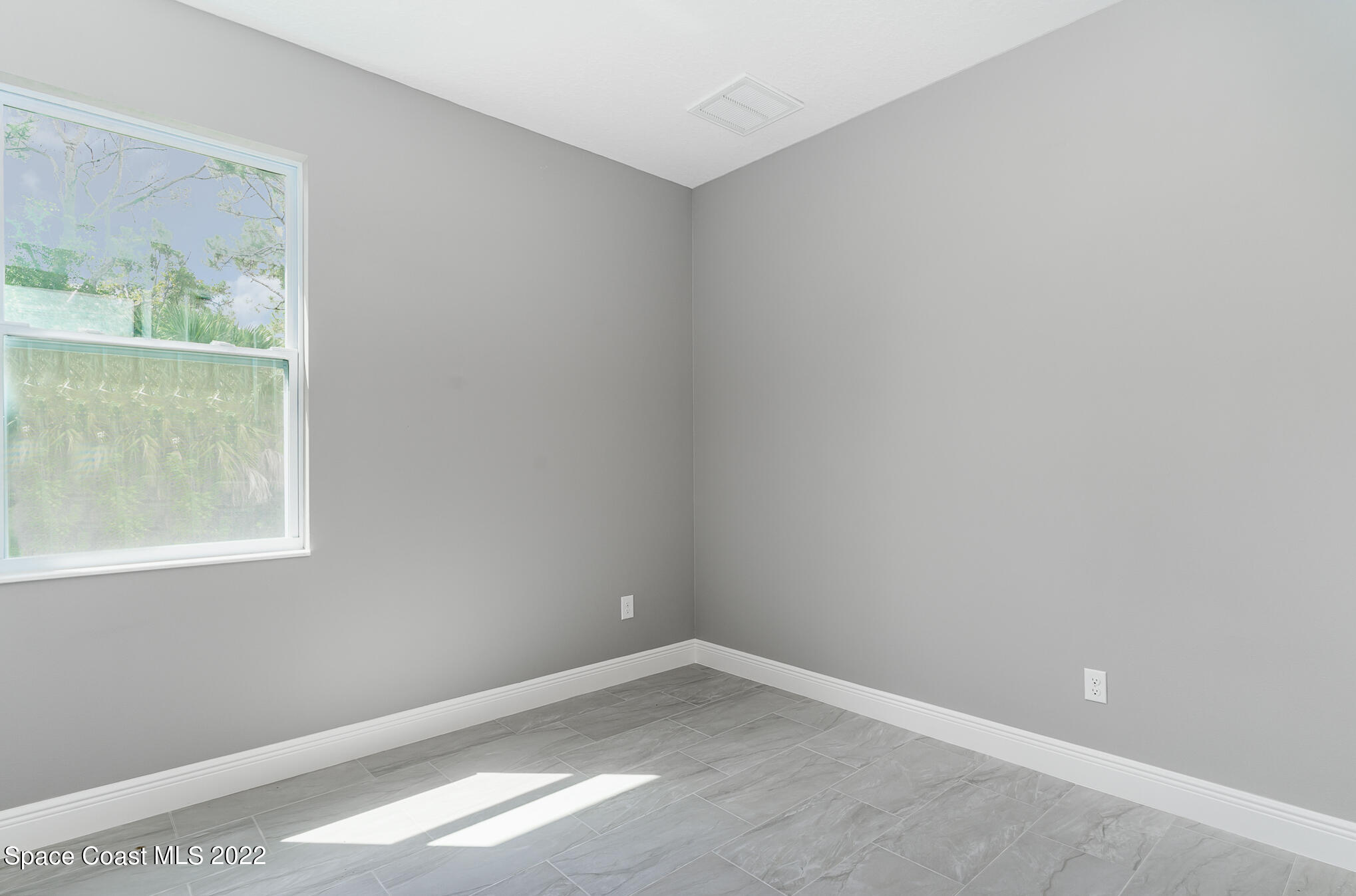 295 San Marino Road Southwest Palm Bay, FL 32908 - Photo 40 of 49 an empty room with a window