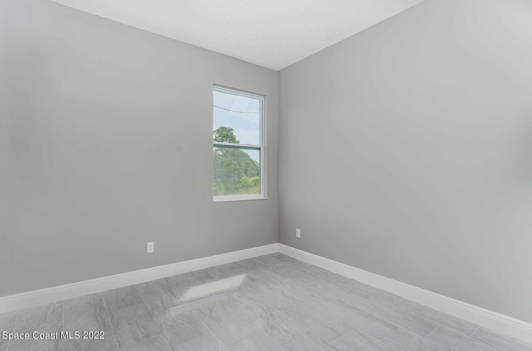 295 San Marino Road Southwest Palm Bay, FL 32908 - Photo 43 of 49 an empty room with a window