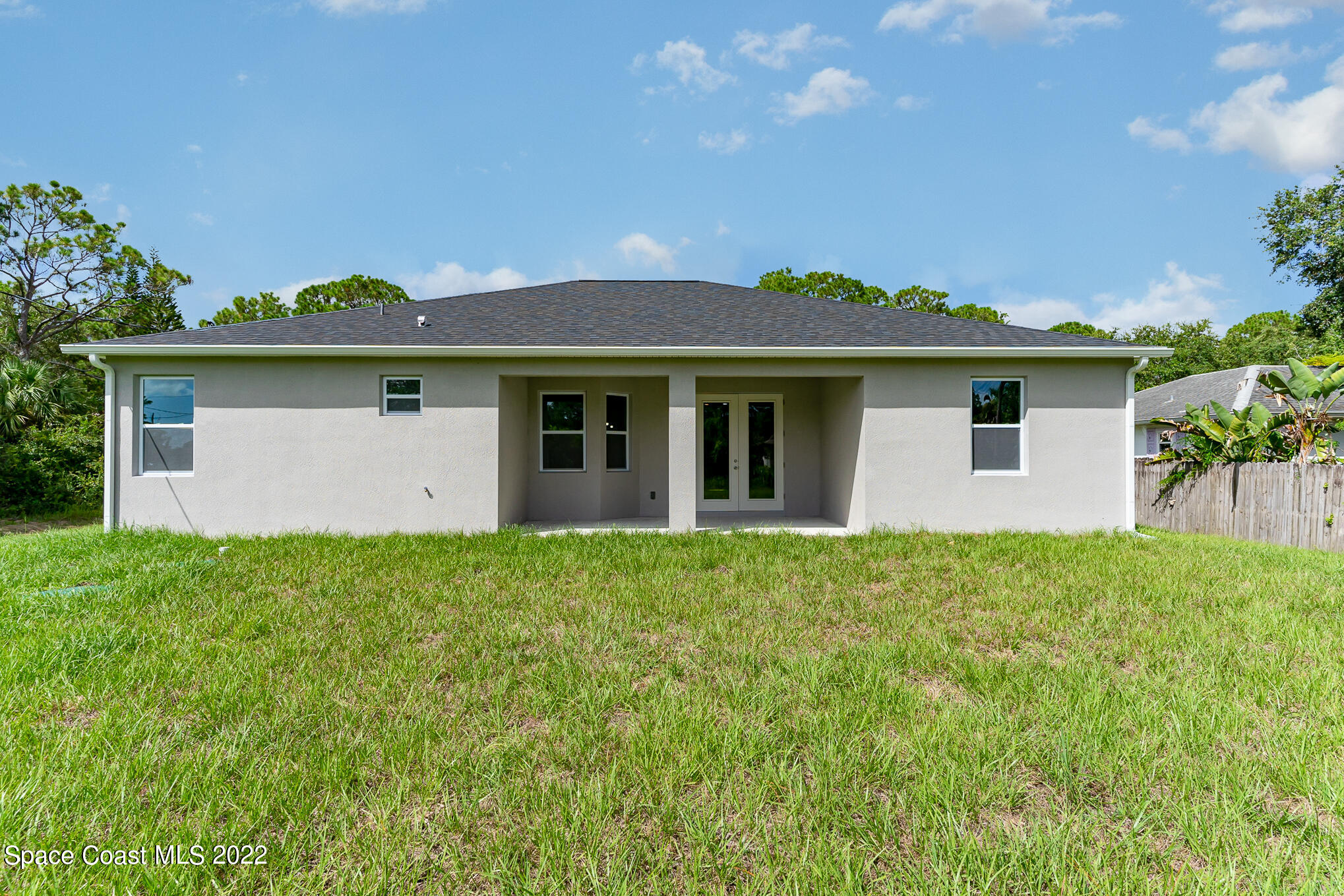 295 San Marino Road Southwest Palm Bay, FL 32908 - Photo 46 of 49 a front view of house with yard and green space