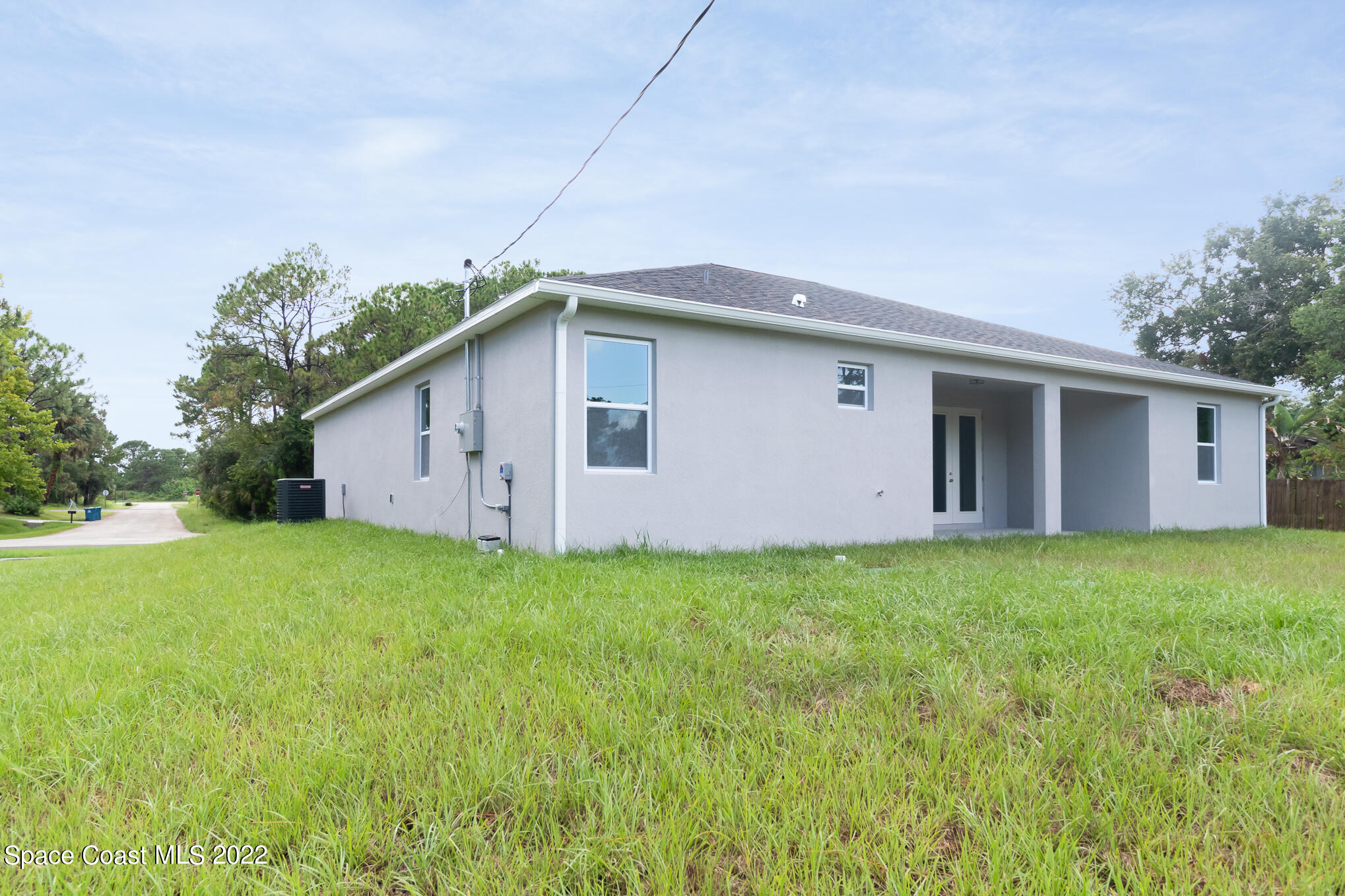 295 San Marino Road Southwest Palm Bay, FL 32908 - Photo 8 of 49 a house view with a backyard space