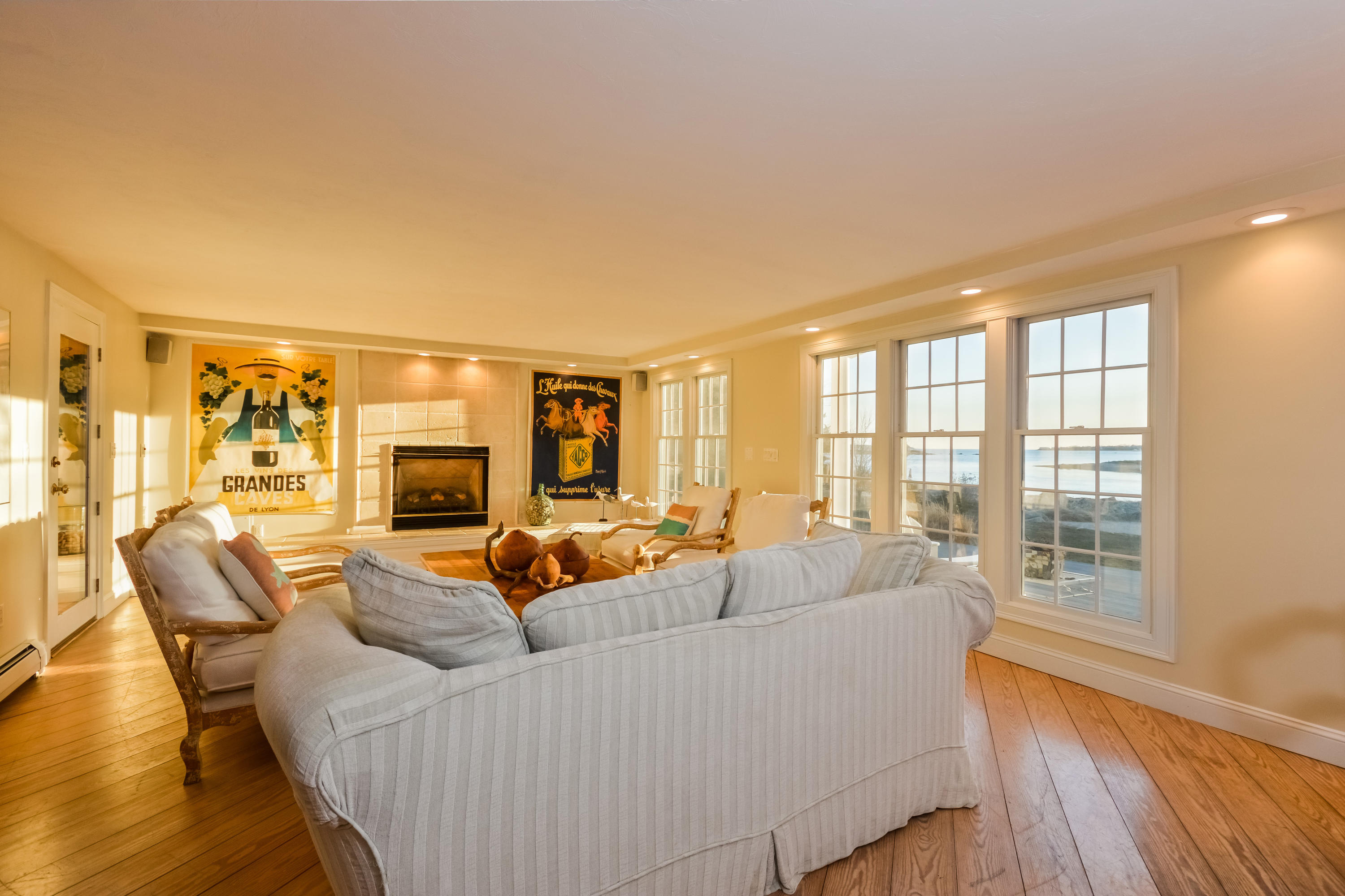 310 Shore Road Bourne, MA 02532 - Photo 12 of 31 a living room with furniture and a fireplace