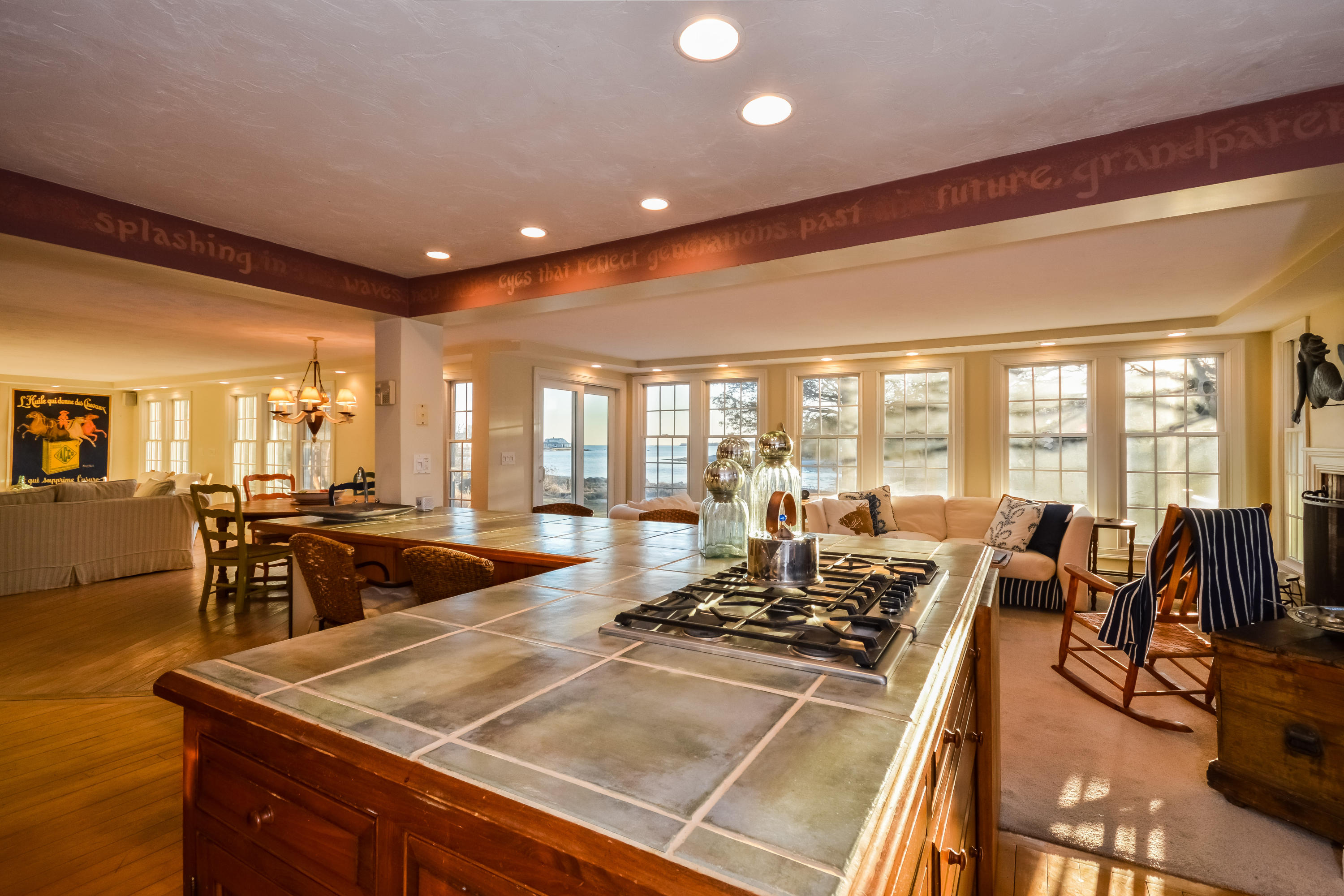 310 Shore Road Bourne, MA 02532 - Photo 13 of 31 a room with lots of tables chairs and a large window