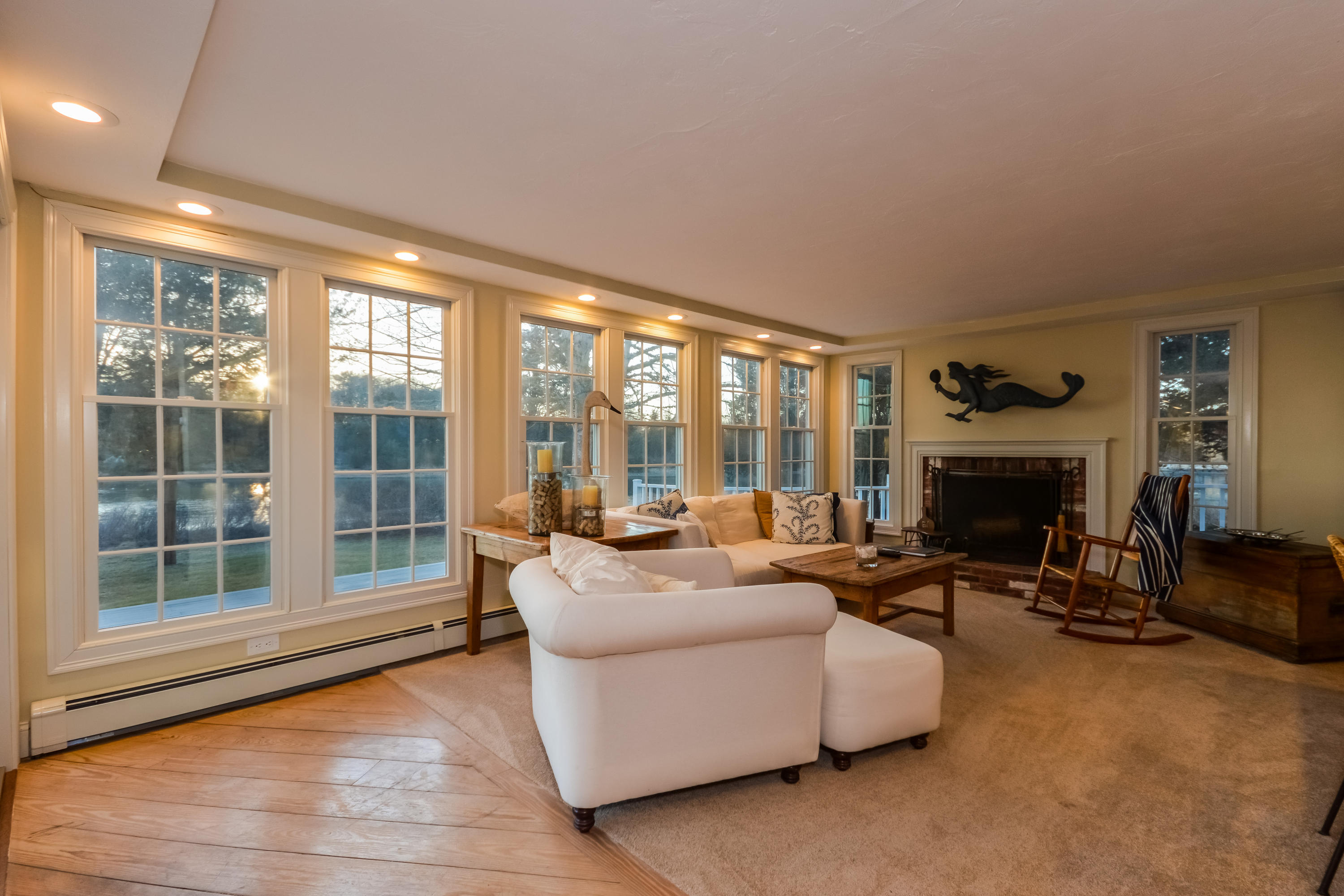 310 Shore Road Bourne, MA 02532 - Photo 16 of 31 a living room with furniture and a fireplace