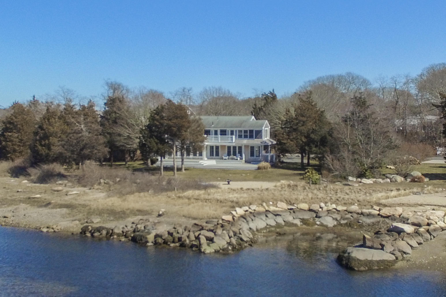 310 Shore Road Bourne, MA 02532 - Photo 28 of 31 a view of a house with a yard