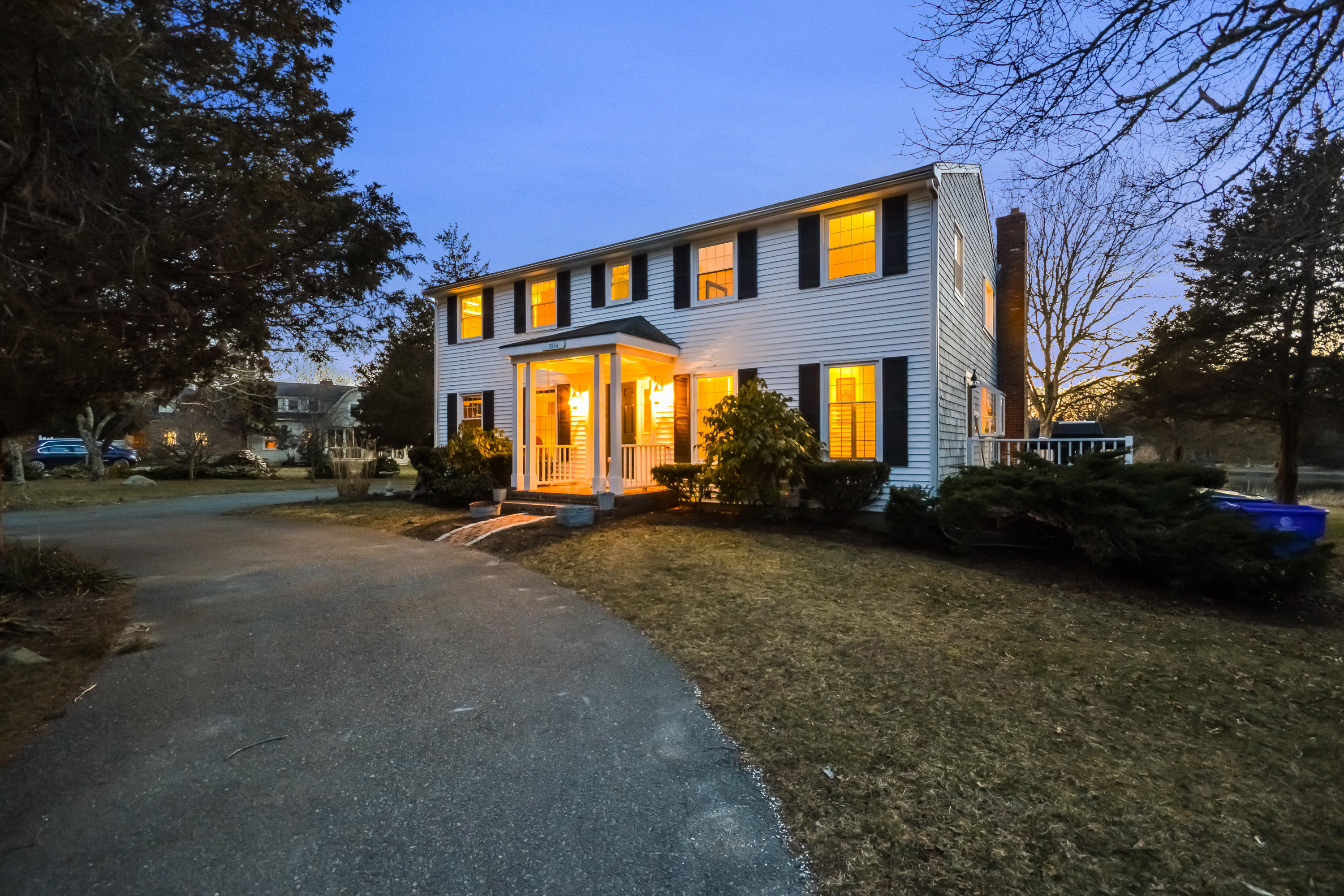 310 Shore Road Bourne, MA 02532 - Photo 3 of 31 a front view of a house with a yard