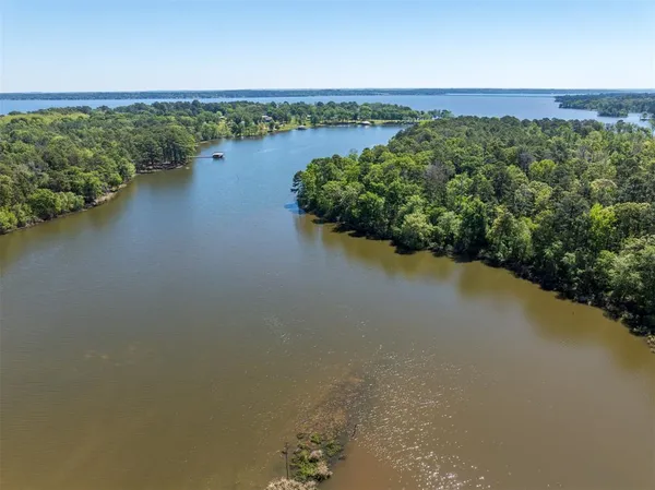 an aerial view of valley and lake