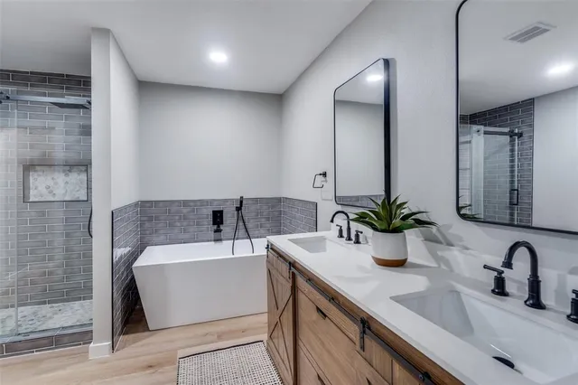 a bathroom with a bathtub and a sink
