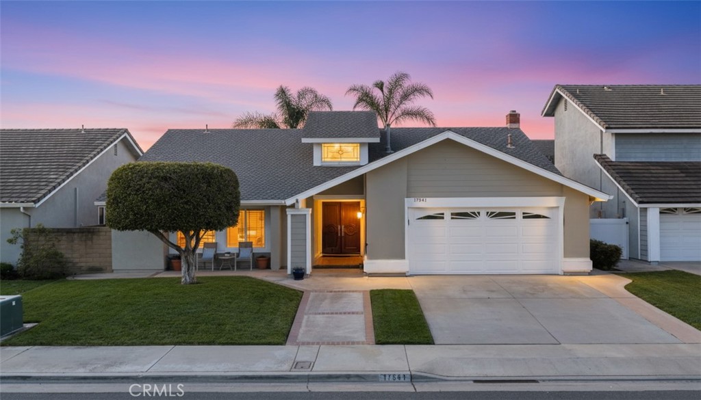 17541 Beckwall Lane Huntington Beach, CA 92649 - Photo 1 of 1 a front view of a house with a yard and garage