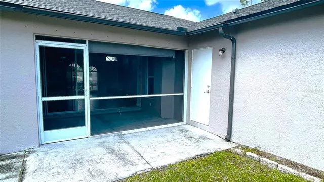 a view of a house with swimming pool and a yard