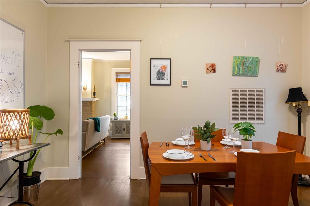 2623 Salado Street Austin, TX 78705 - Photo 17 of 36 a view of a dining room with furniture and wooden floor