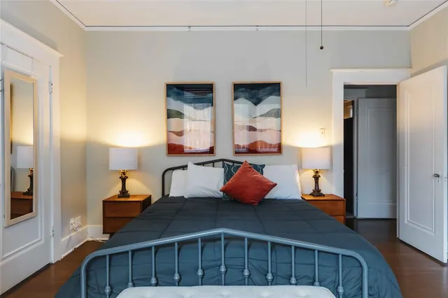 a bedroom with furniture and a window