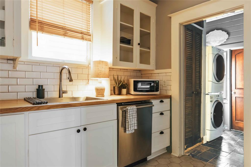 2623 Salado Street Austin, TX 78705 - Photo 5 of 36 a kitchen with stainless steel appliances granite countertop a sink and a refrigerator