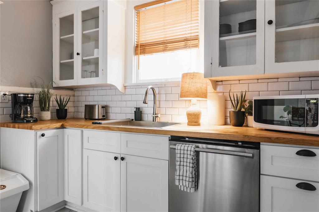 2623 Salado Street Austin, TX 78705 - Photo 6 of 36 a kitchen with stainless steel appliances a sink and cabinets