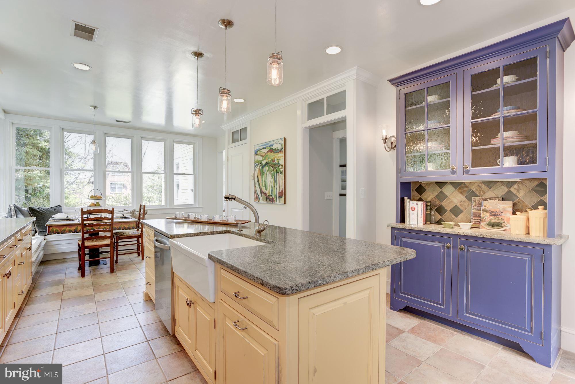 3807 Williams Lane Chevy Chase, MD 20815 - Photo 12 of 30 a kitchen with granite countertop a sink and a stove