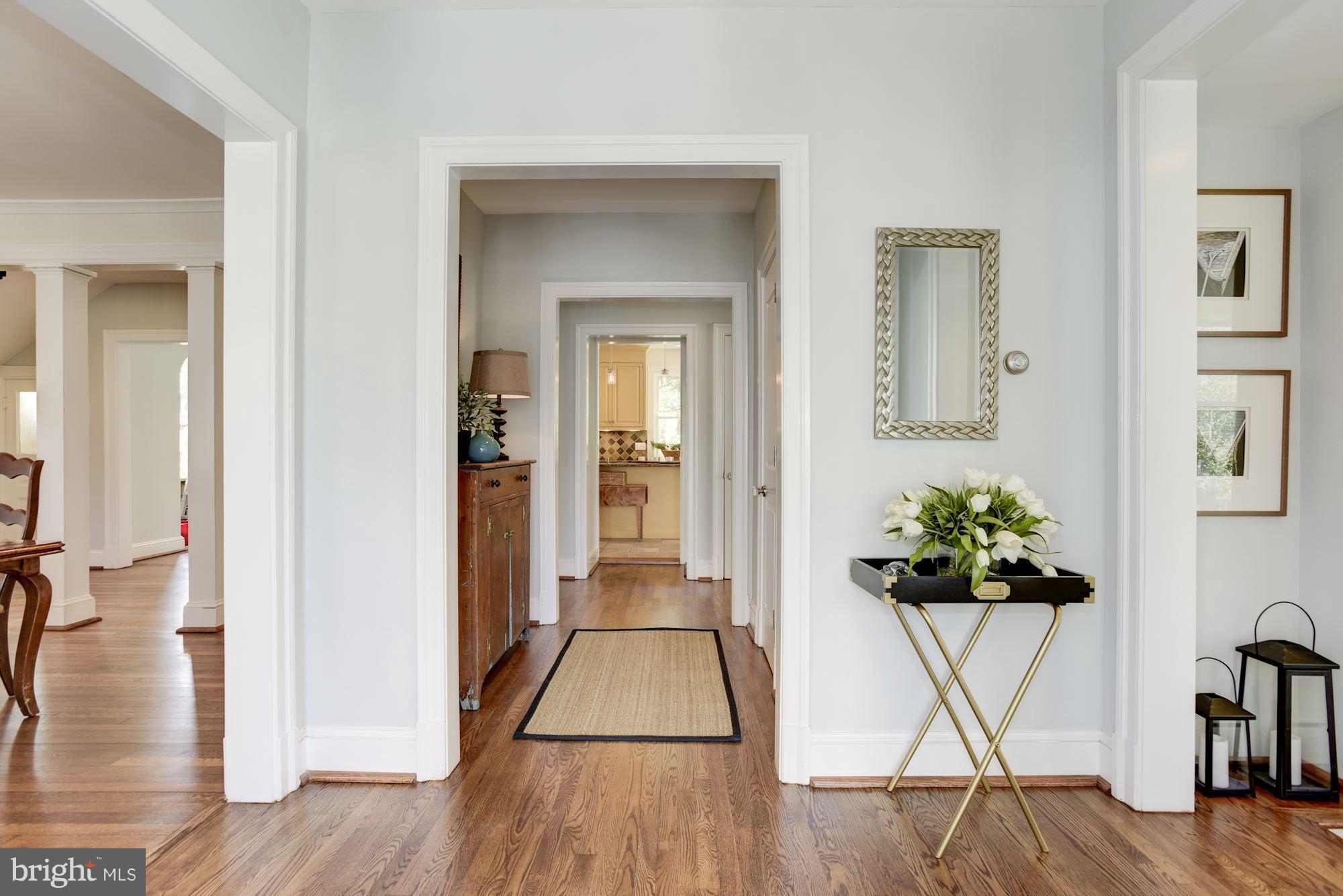3807 Williams Lane Chevy Chase, MD 20815 - Photo 15 of 30 a view of a hallway with wooden floor and a potted plant