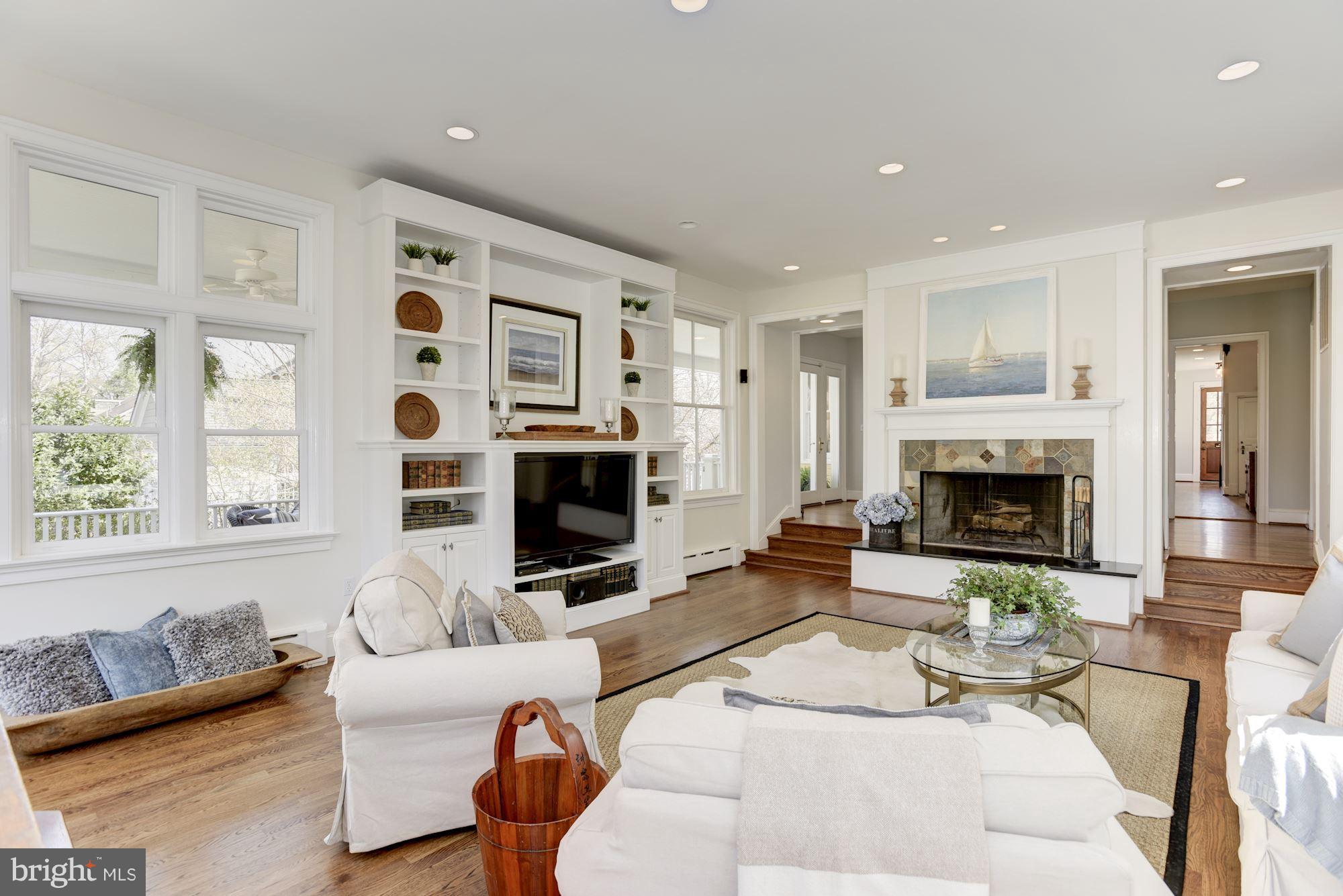 3807 Williams Lane Chevy Chase, MD 20815 - Photo 18 of 30 a living room with furniture a fireplace and a large window