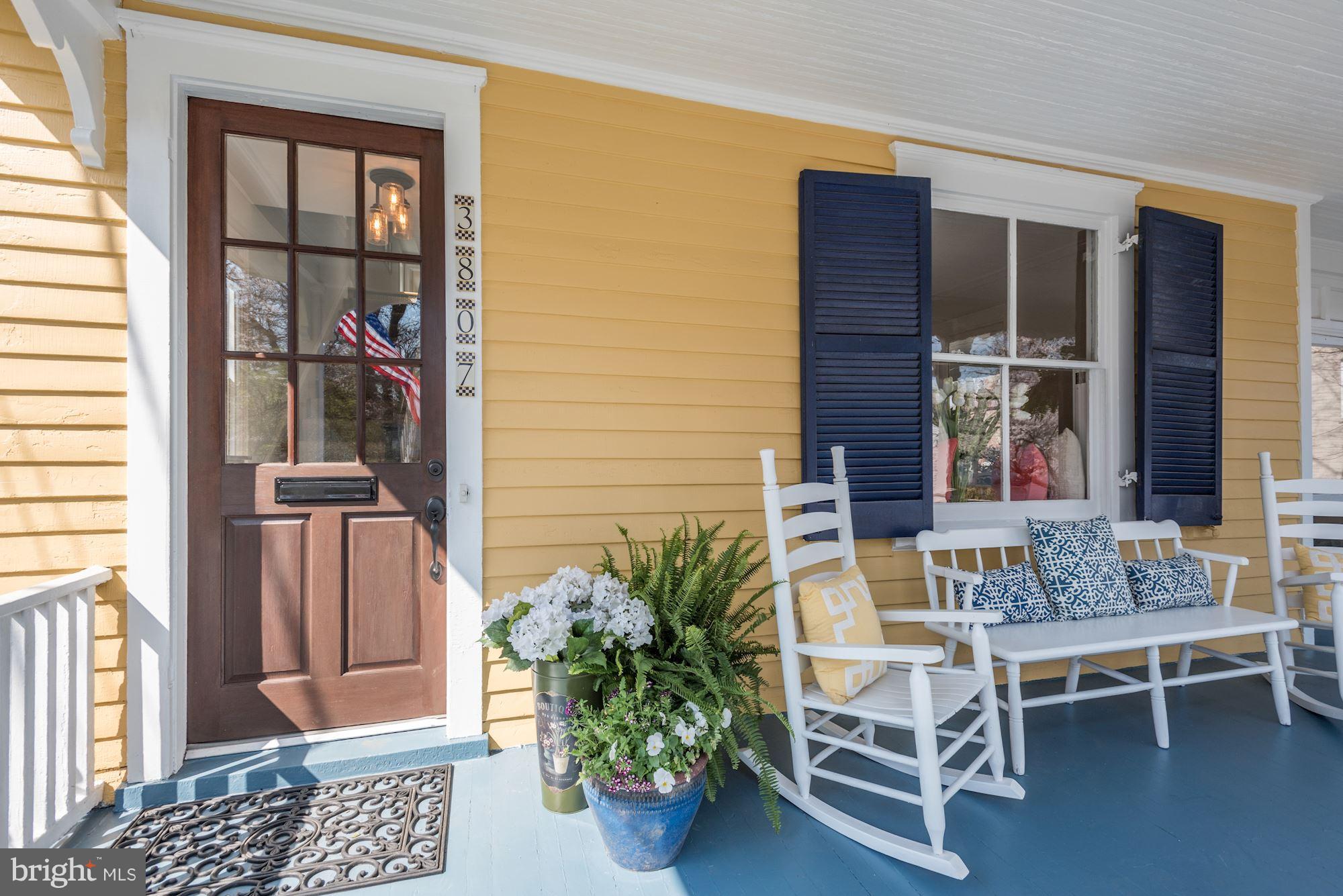 3807 Williams Lane Chevy Chase, MD 20815 - Photo 3 of 30 a balcony with furniture and a potted plant