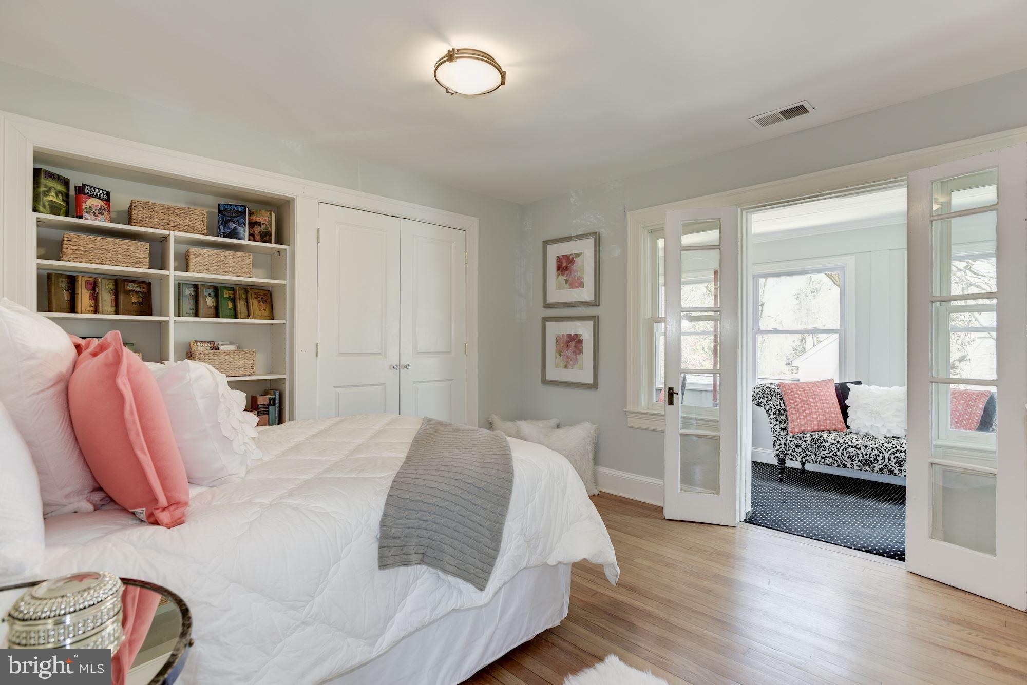 3807 Williams Lane Chevy Chase, MD 20815 - Photo 22 of 30 a bedroom with a bed and wooden floor