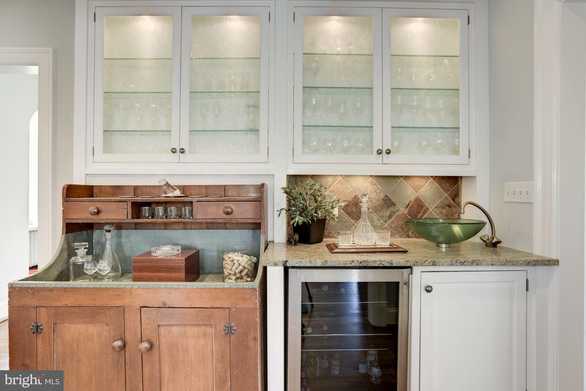 3807 Williams Lane Chevy Chase, MD 20815 - Photo 9 of 30 a kitchen with stainless steel appliances granite countertop white cabinets and a stove